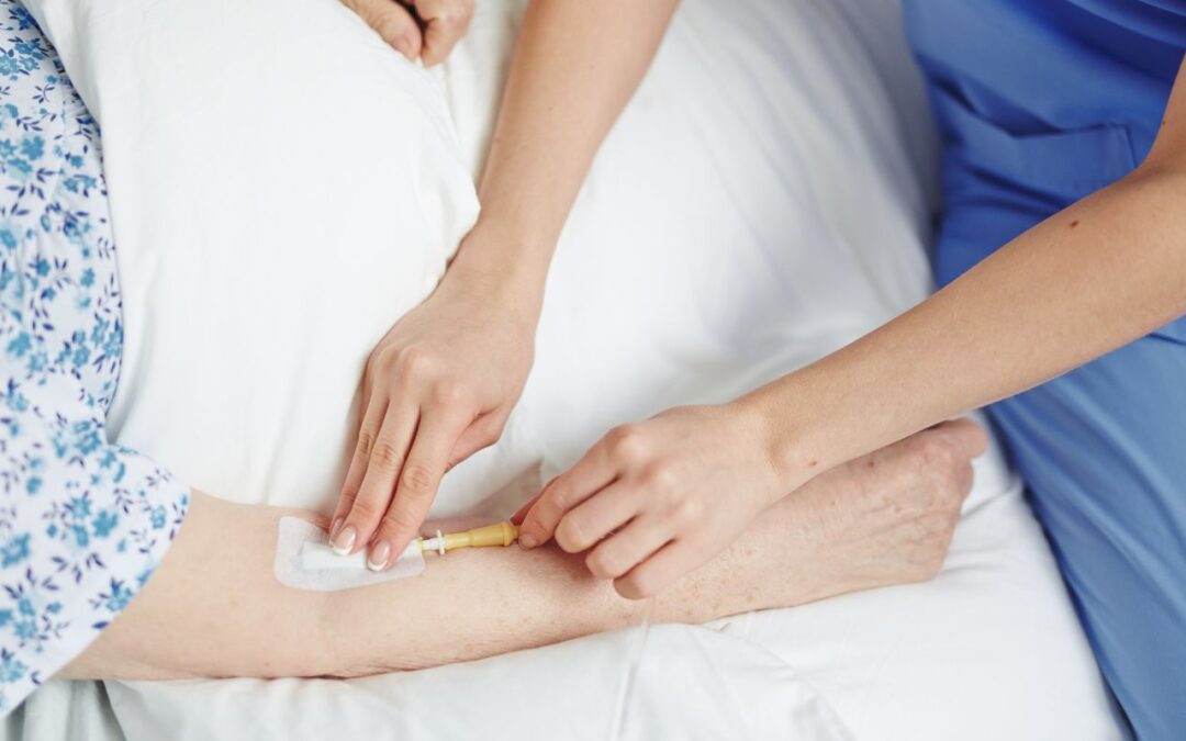A caregiver performing Intravenous therapy - healthcare services
